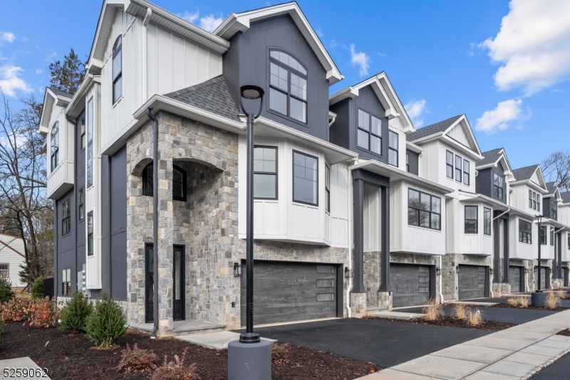 147 Center Avenue, Unit 20 Old Tappan, NJ 07675 - Photo 44 of 48 a front view of a house with a yard