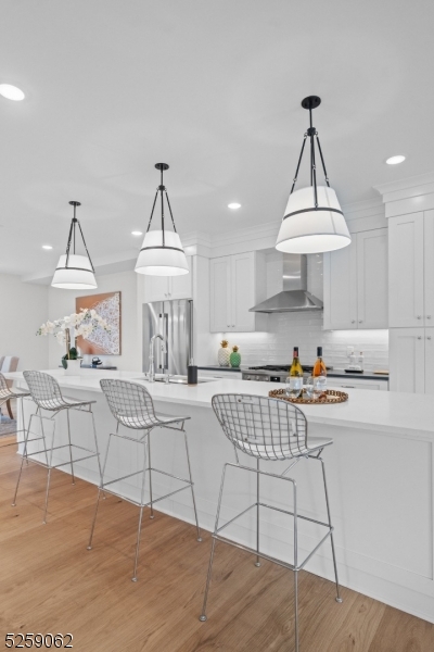 147 Center Avenue, Unit 20 Old Tappan, NJ 07675 - Photo 10 of 48 a living room with furniture a table and a chandelier