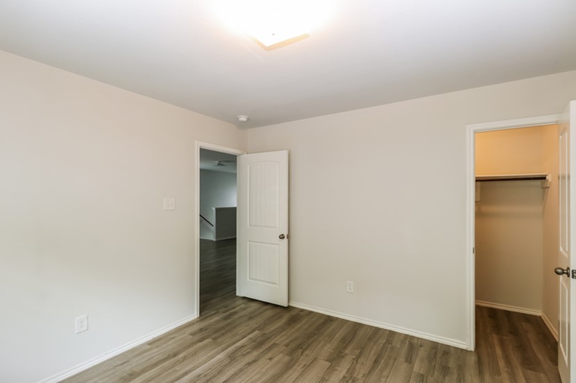2744 Madison Court Willis, TX 77378 - Photo 15 of 16 a view of an empty room with wooden floor