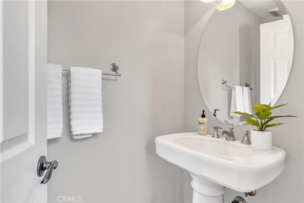 78 Dawnwood Ladera Ranch, CA 92694 - Photo 15 of 54 a bathroom with a sink and a mirror