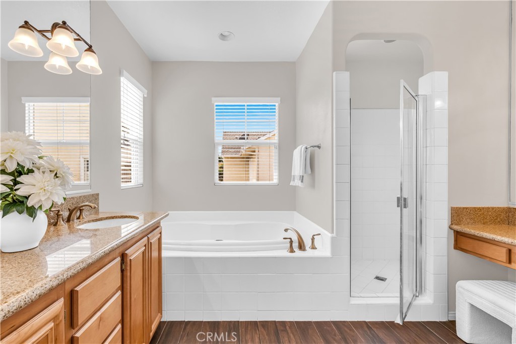 78 Dawnwood Ladera Ranch, CA 92694 - Photo 19 of 54 a bathroom with a tub sink and mirror