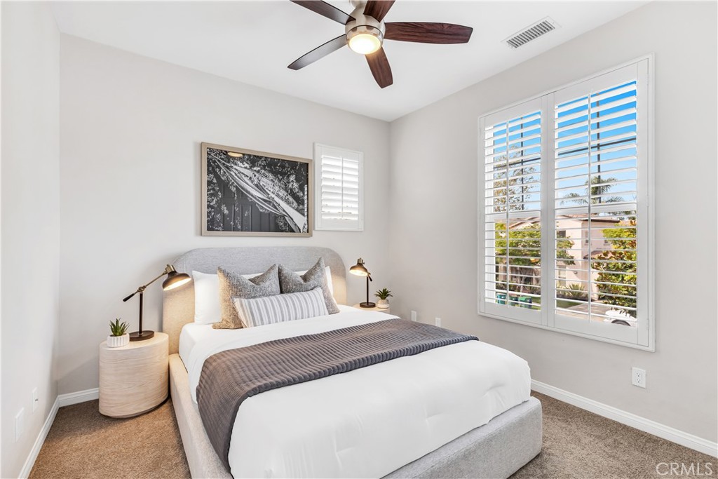 78 Dawnwood Ladera Ranch, CA 92694 - Photo 21 of 54 a bedroom with a large bed and a window