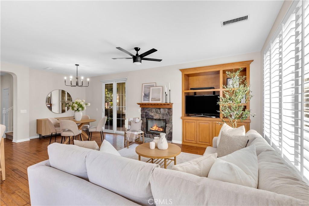 78 Dawnwood Ladera Ranch, CA 92694 - Photo 9 of 54 a living room with furniture fireplace and a flat screen tv