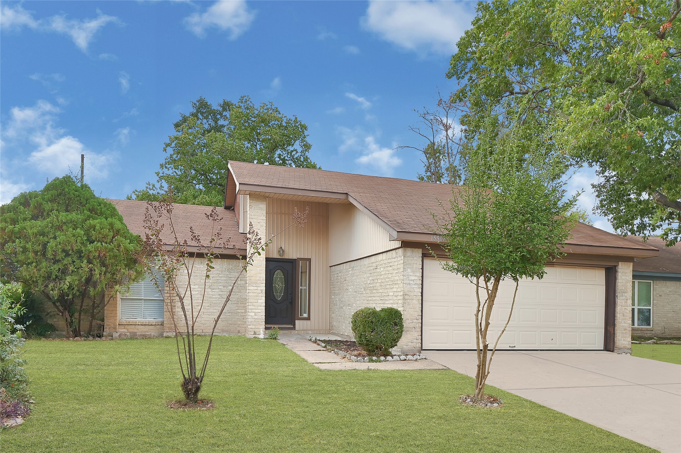 15907 Timber Valley Drive Houston, TX 77070 - Photo 1 of 27 a front view of a house with a yard