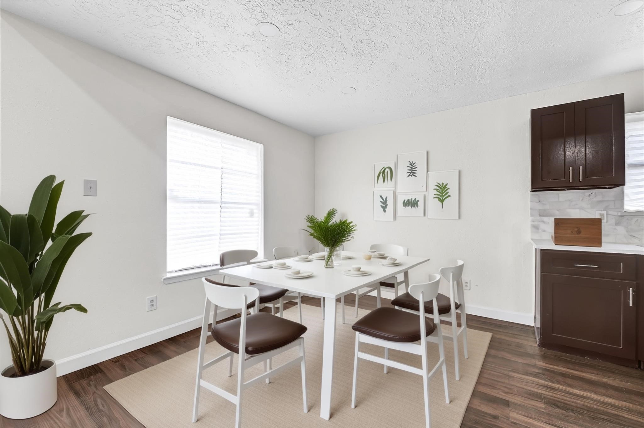 15907 Timber Valley Drive Houston, TX 77070 - Photo 12 of 27 a view of a dining room with furniture and wooden floor