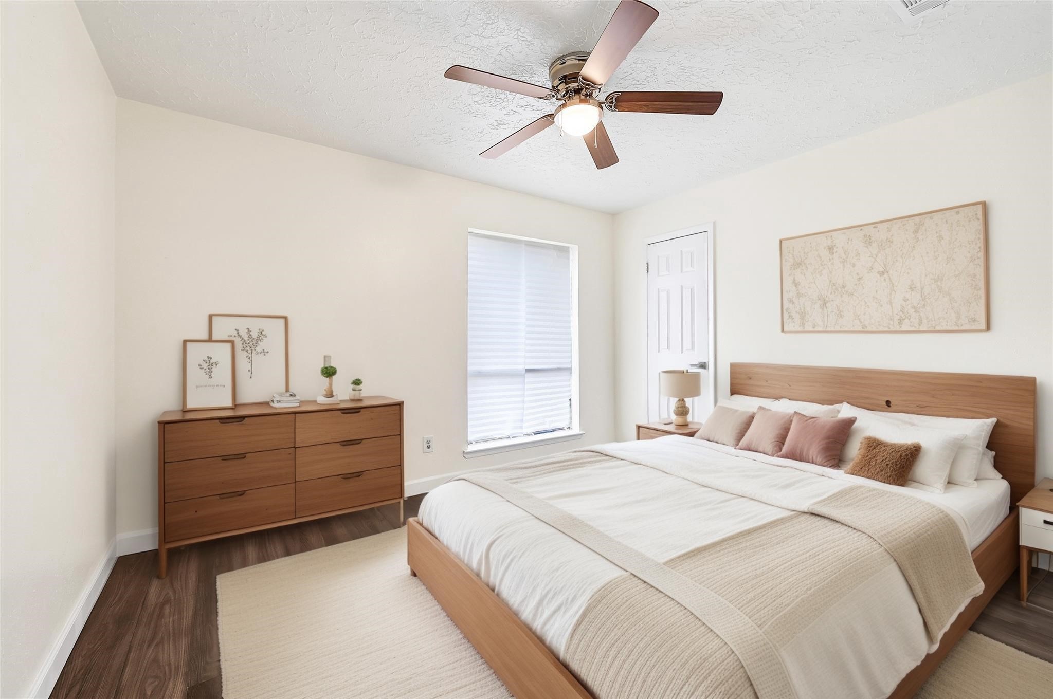 15907 Timber Valley Drive Houston, TX 77070 - Photo 17 of 27 a bedroom with a bed chandelier and a window