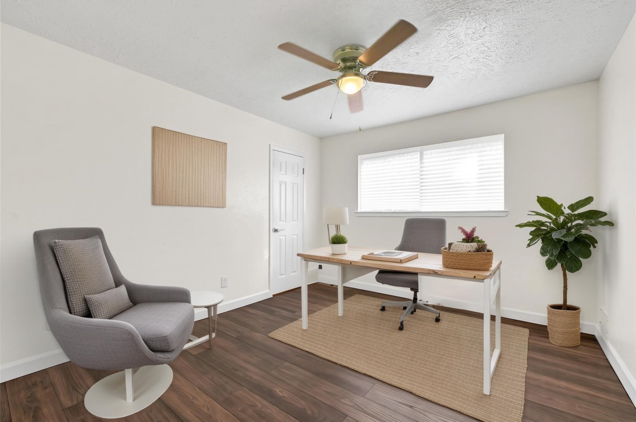 15907 Timber Valley Drive Houston, TX 77070 - Photo 19 of 27 a work room with furniture and a potted plant