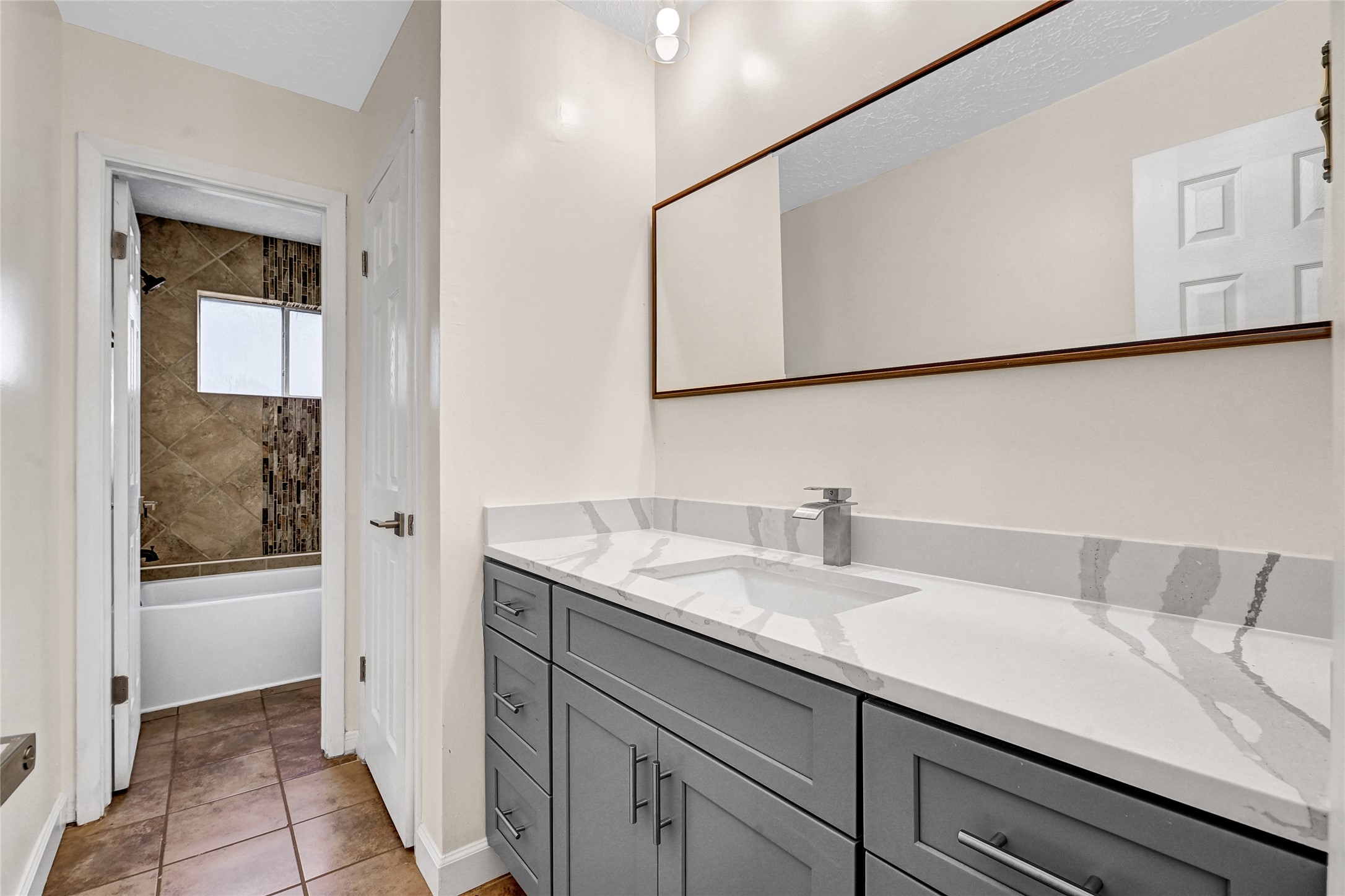 15907 Timber Valley Drive Houston, TX 77070 - Photo 21 of 27 a bathroom with a sink and a mirror