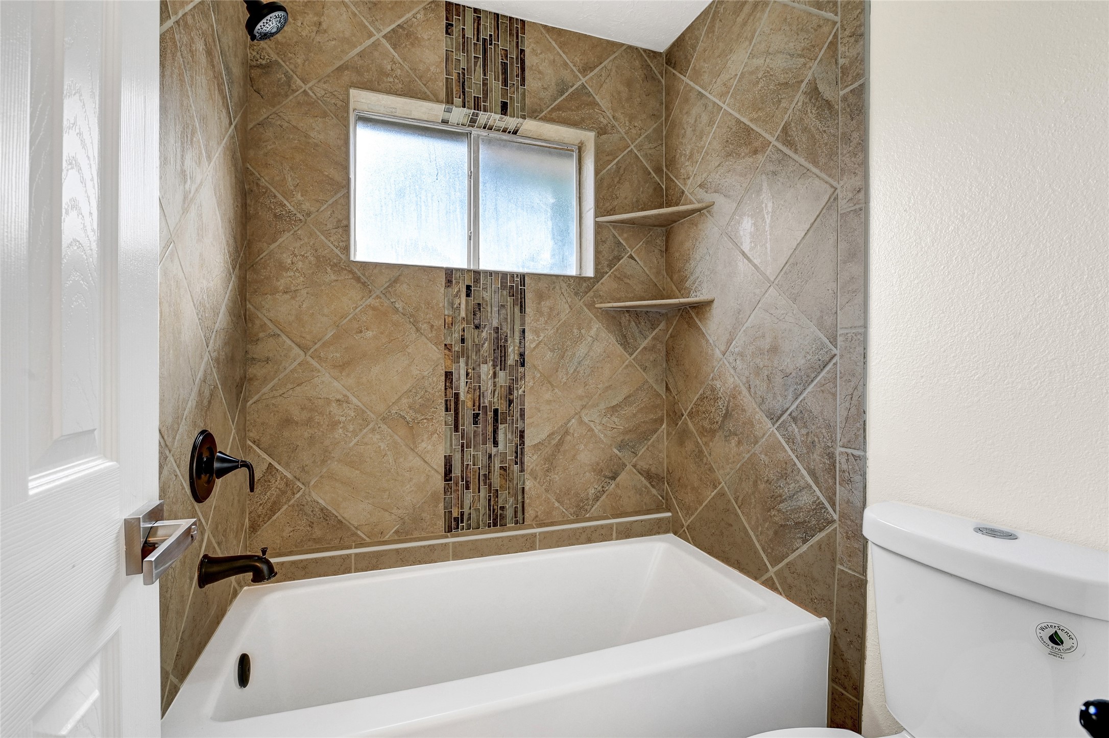 15907 Timber Valley Drive Houston, TX 77070 - Photo 22 of 27 a bath tub sitting next to a white sink and vanity