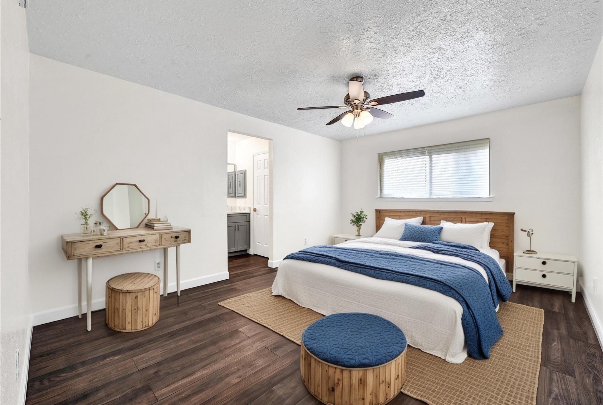 15907 Timber Valley Drive Houston, TX 77070 - Photo 24 of 27 a bedroom with a bed and a chandelier