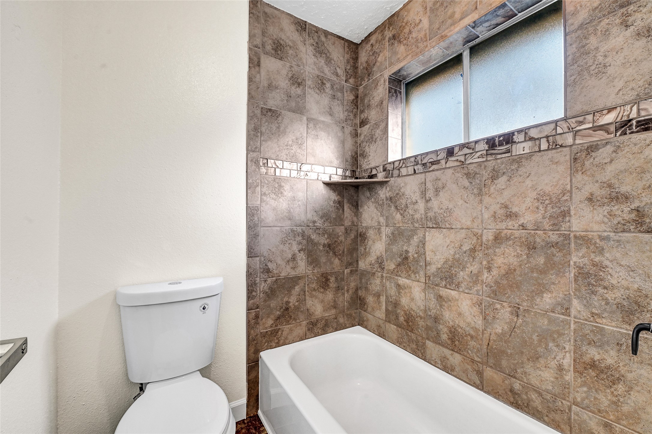 15907 Timber Valley Drive Houston, TX 77070 - Photo 27 of 27 a bathroom with a toilet and a sink