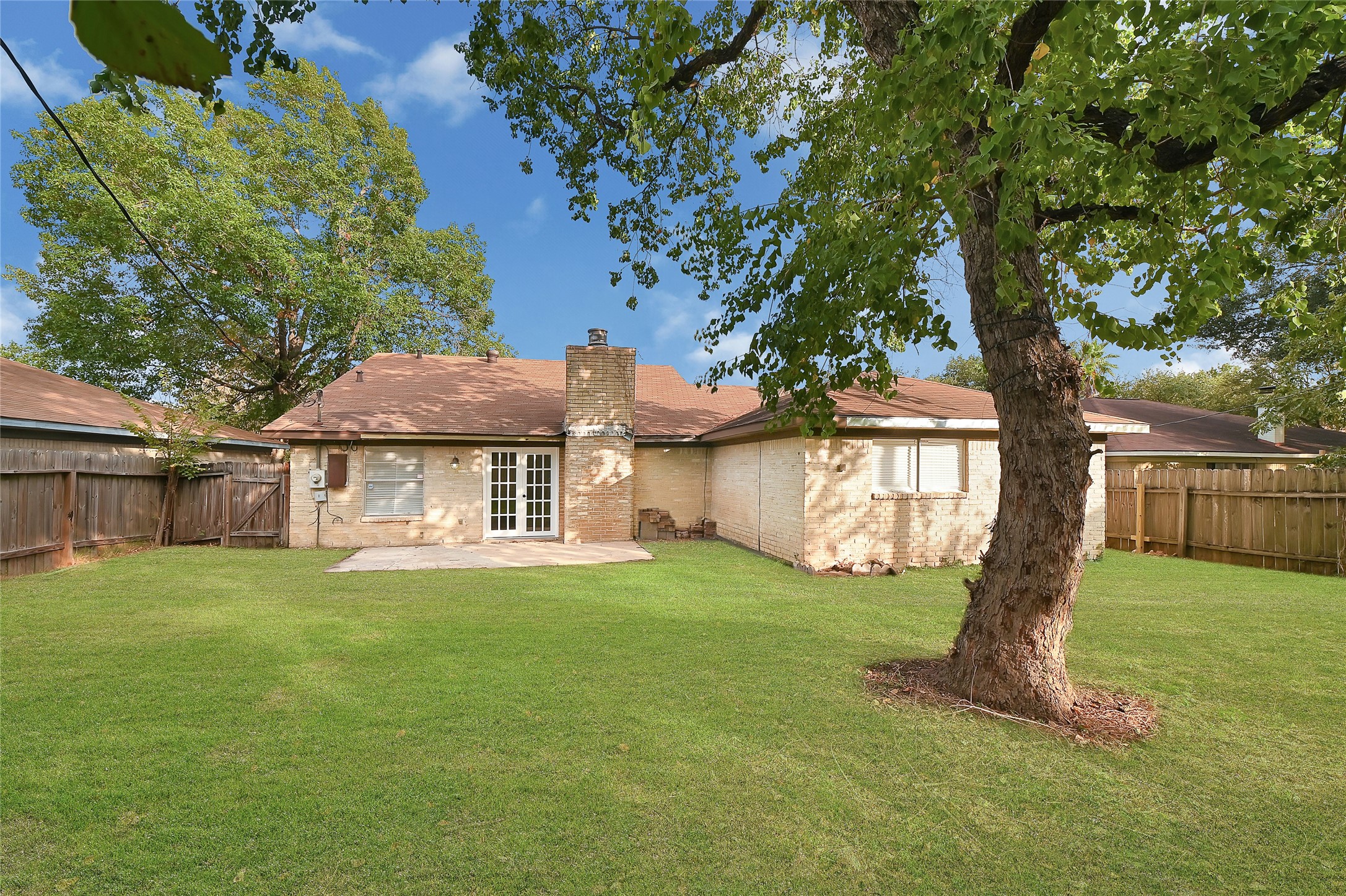 15907 Timber Valley Drive Houston, TX 77070 - Photo 4 of 27 a view of a house with backyard and a tree