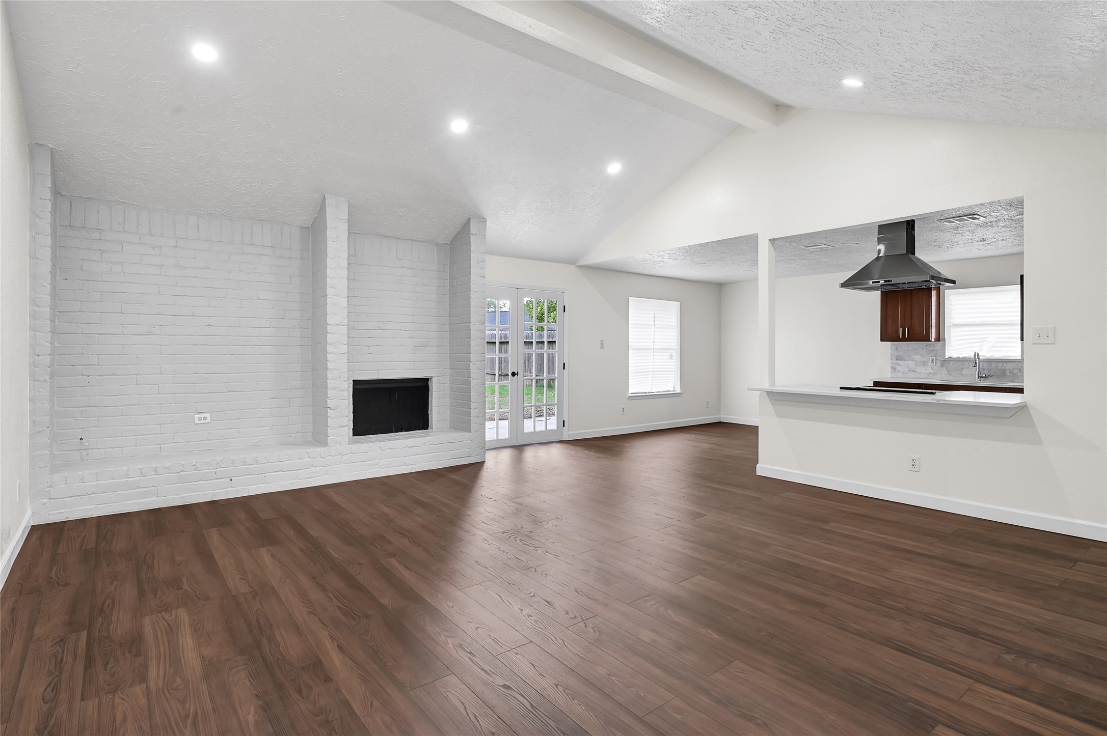 15907 Timber Valley Drive Houston, TX 77070 - Photo 6 of 27 a view of an empty room with a window and wooden floor