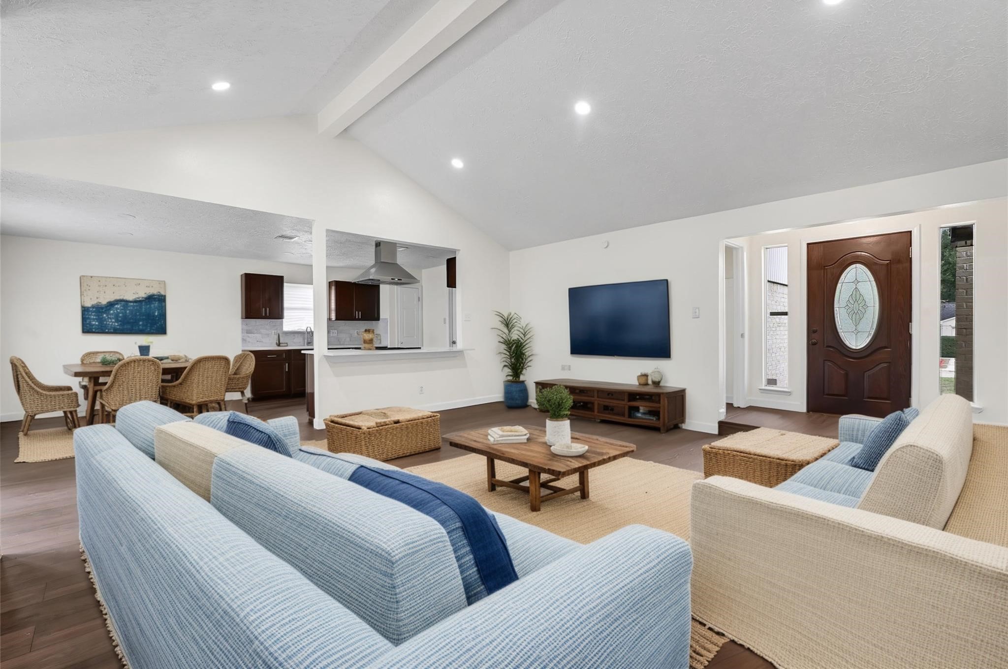 15907 Timber Valley Drive Houston, TX 77070 - Photo 9 of 27 a living room with furniture and a flat screen tv