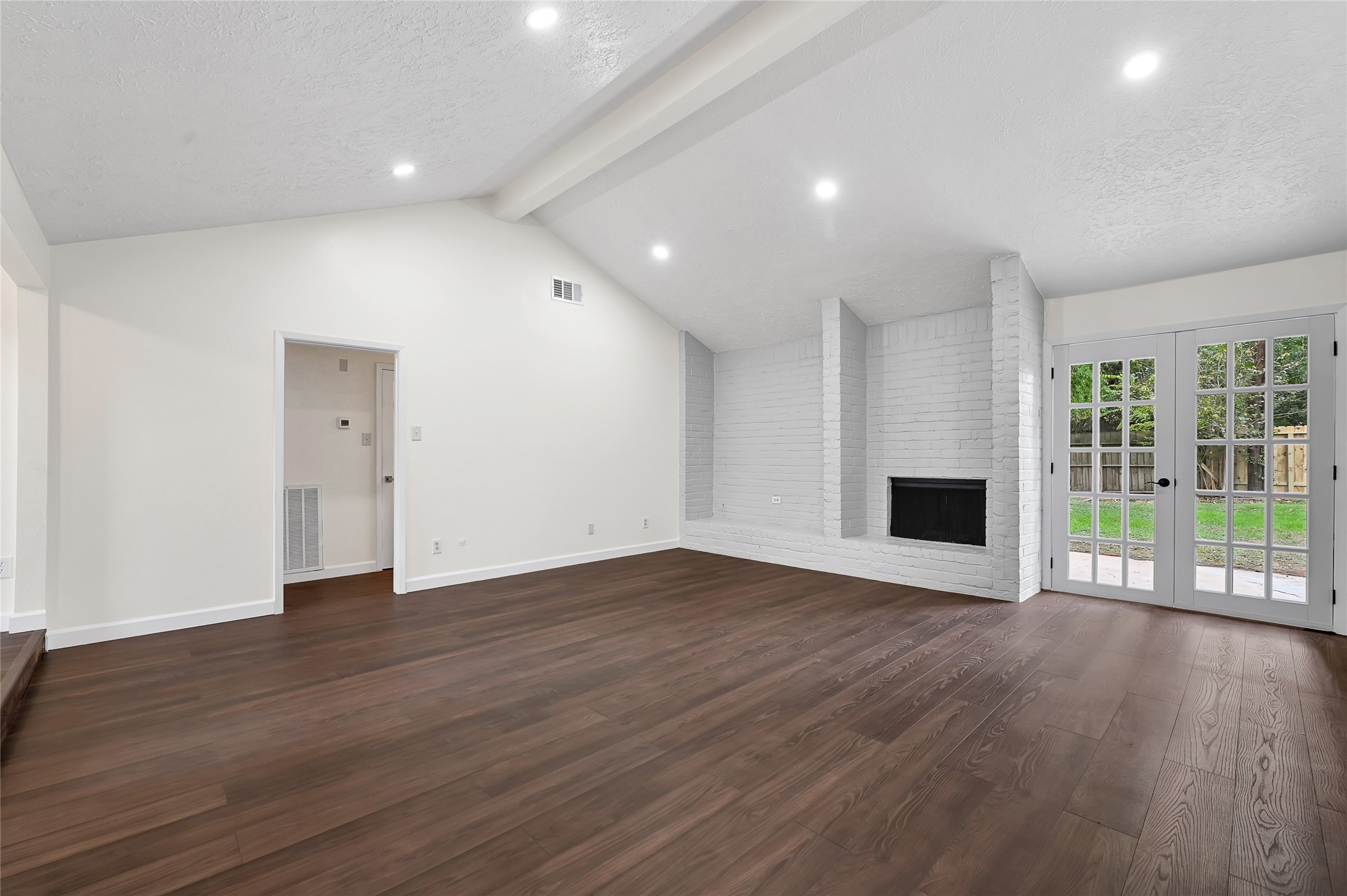 15907 Timber Valley Drive Houston, TX 77070 - Photo 10 of 27 a view of an empty room with wooden floor and a window