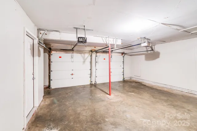 a view of a backyard with a large tree