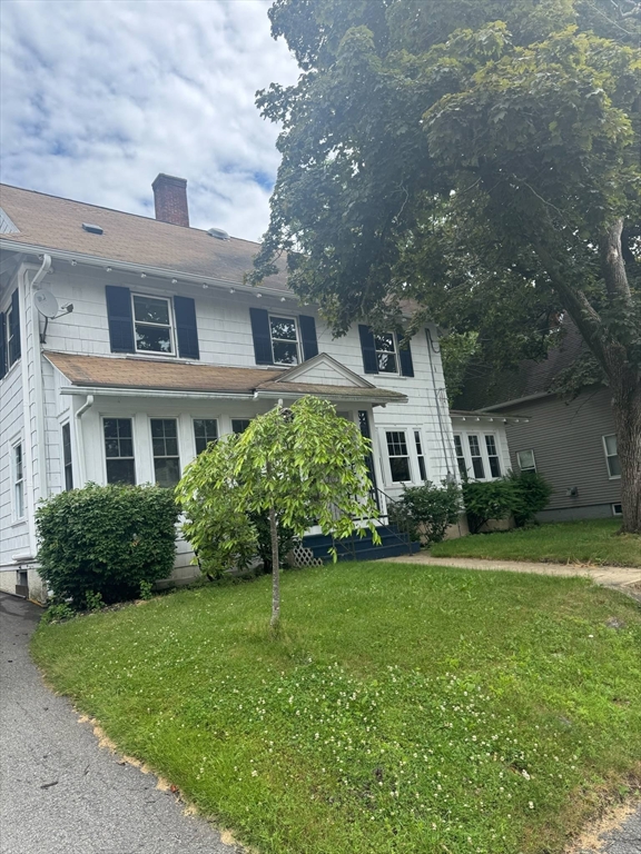 104 Maple Street Gardner, MA 01440 - Photo 2 of 15 a front view of a house with a yard