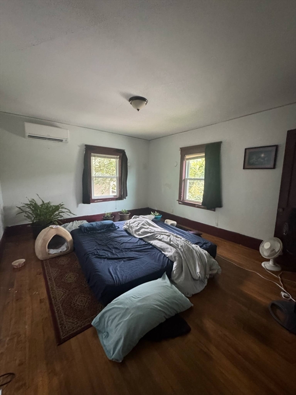 104 Maple Street Gardner, MA 01440 - Photo 8 of 15 a bedroom with bed couch and window