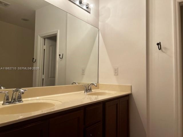 608 Northeast 33rd Terrace, Unit 608 Homestead, FL 33033 - Photo 13 of 35 a bathroom with a sink and a mirror