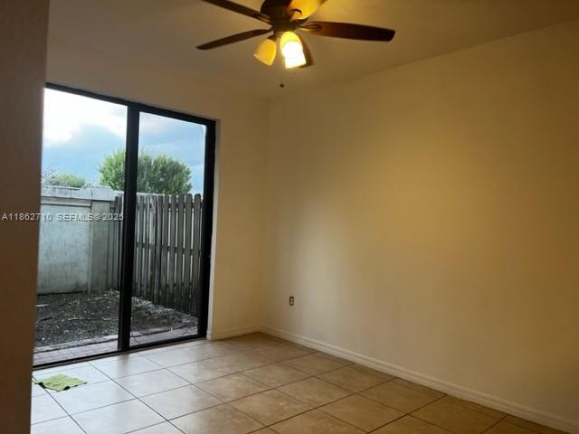 608 Northeast 33rd Terrace, Unit 608 Homestead, FL 33033 - Photo 19 of 35 a view of a glass door and shower