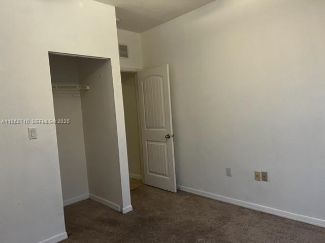 608 Northeast 33rd Terrace, Unit 608 Homestead, FL 33033 - Photo 21 of 35 an empty room with closet