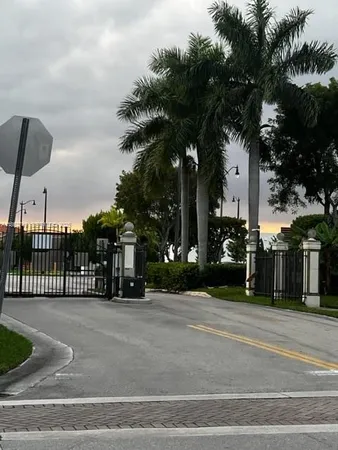 a view of swimming pool with a lake from a balcony