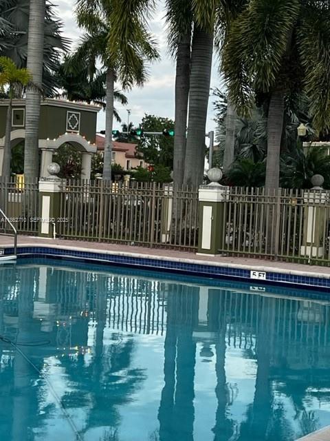 608 Northeast 33rd Terrace, Unit 608 Homestead, FL 33033 - Photo 27 of 35 a view of swimming pool with a lake from a balcony