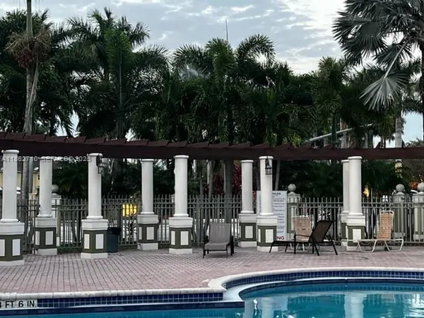 a view of a swimming pool with a patio