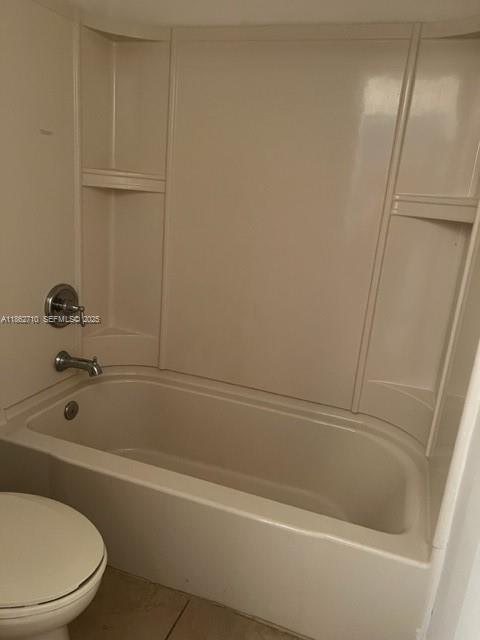 608 Northeast 33rd Terrace, Unit 608 Homestead, FL 33033 - Photo 7 of 35 a bathroom with a bathtub and a shower