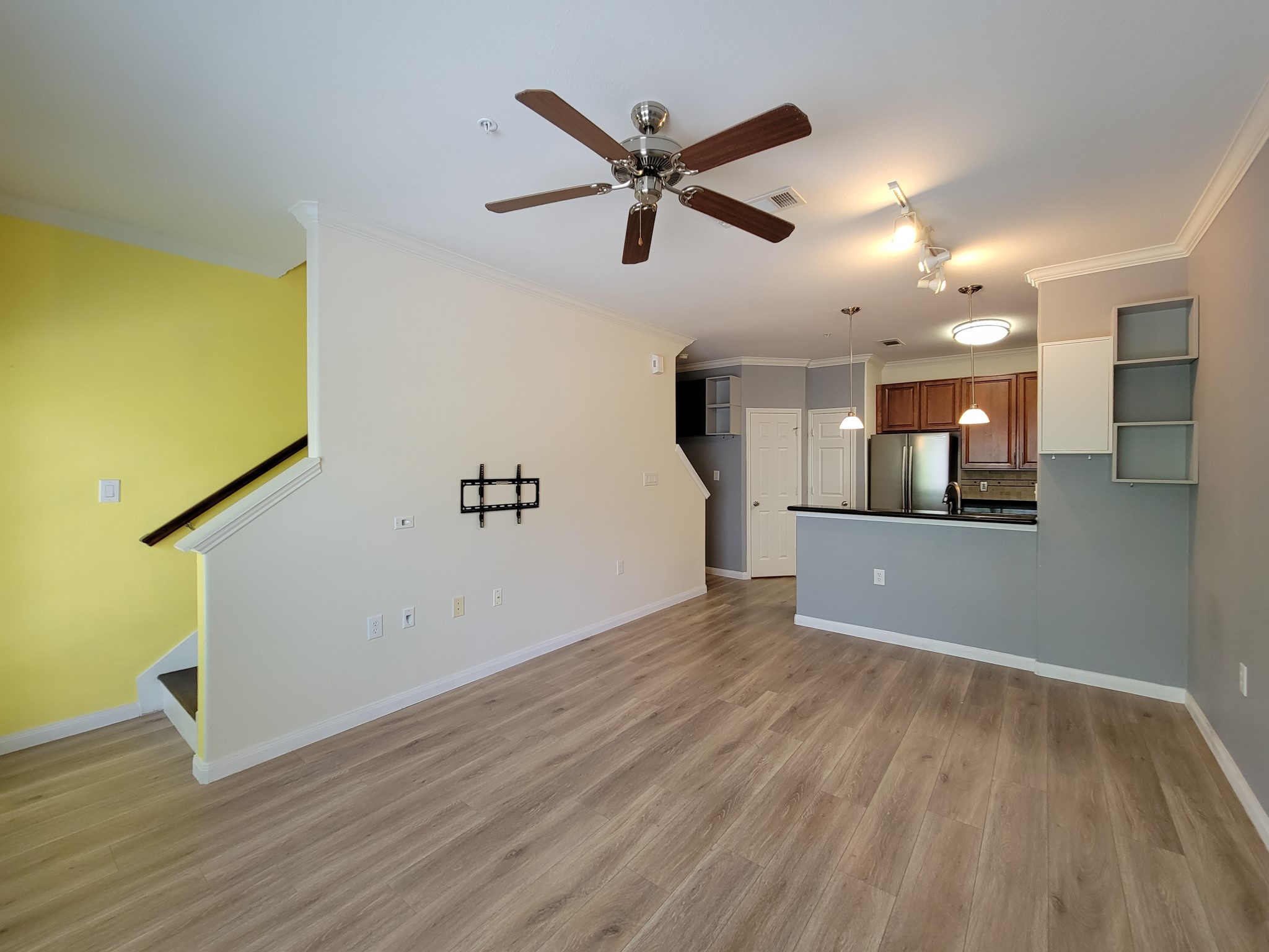 9200 Westheimer Road, Unit 305 Houston, TX 77063 - Photo 11 of 32 a view of a big room with wooden floor and windows
