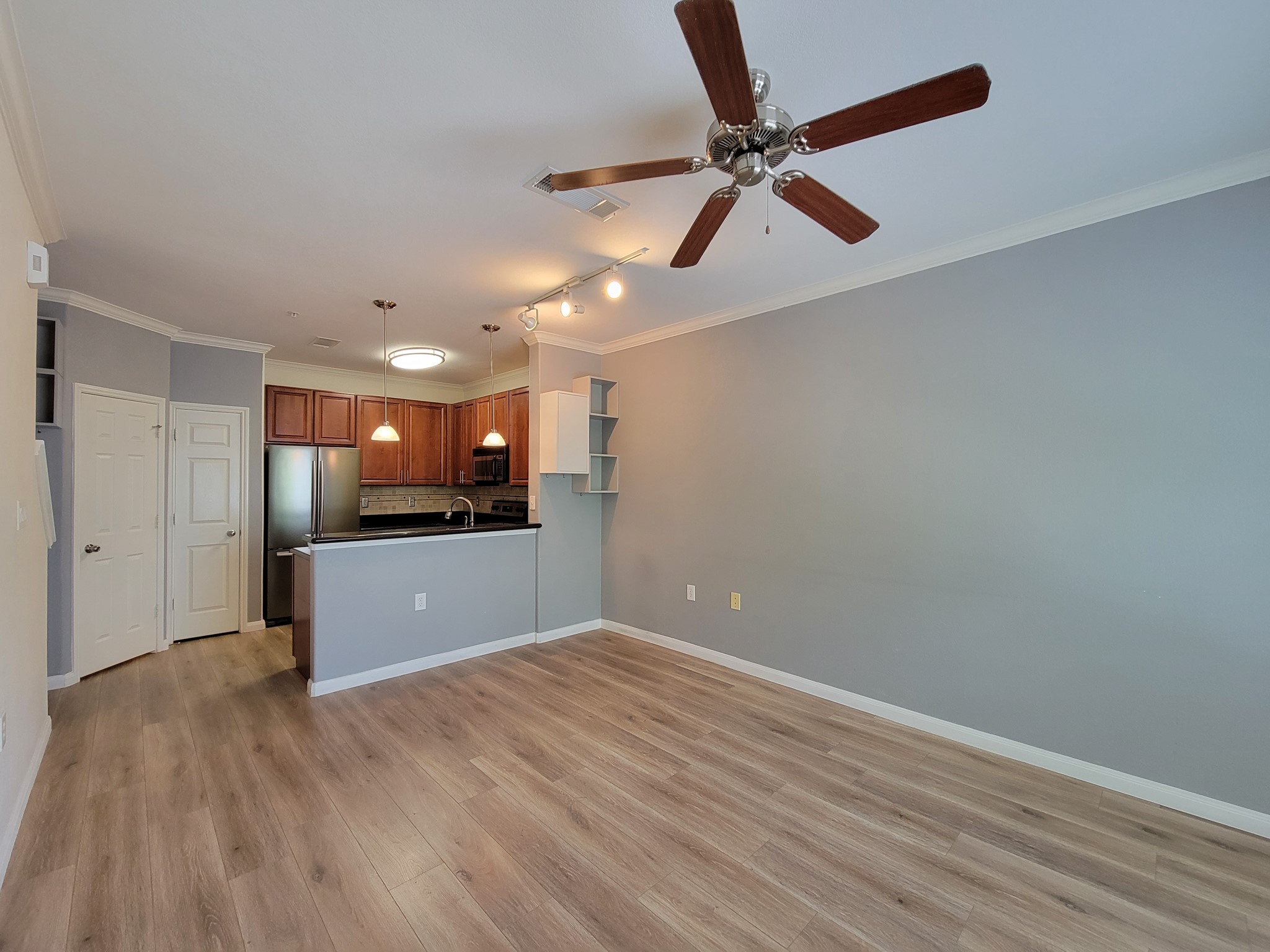 9200 Westheimer Road, Unit 305 Houston, TX 77063 - Photo 13 of 32 a view of empty room with wooden floor
