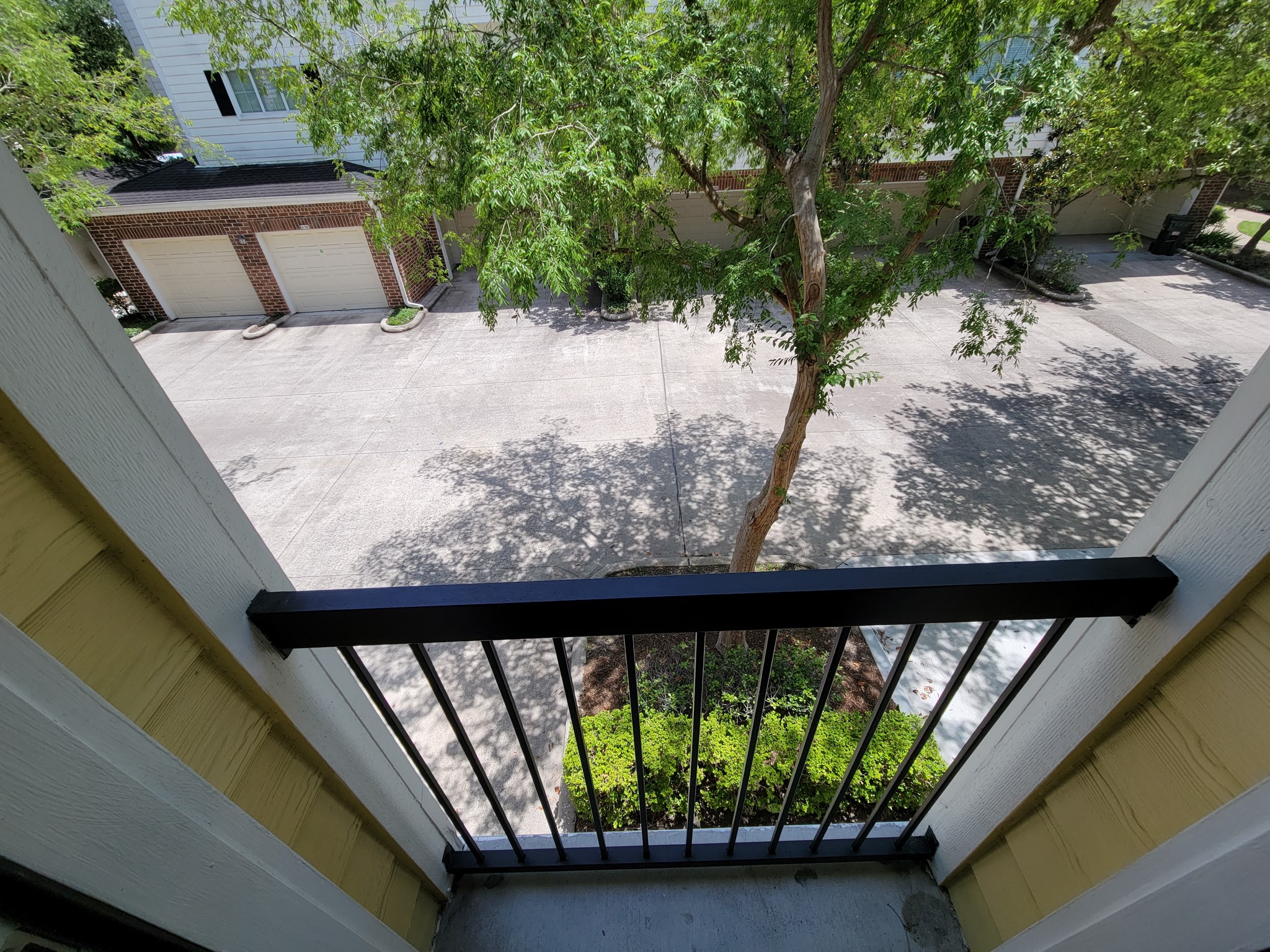 9200 Westheimer Road, Unit 305 Houston, TX 77063 - Photo 14 of 32 a view of balcony and yard