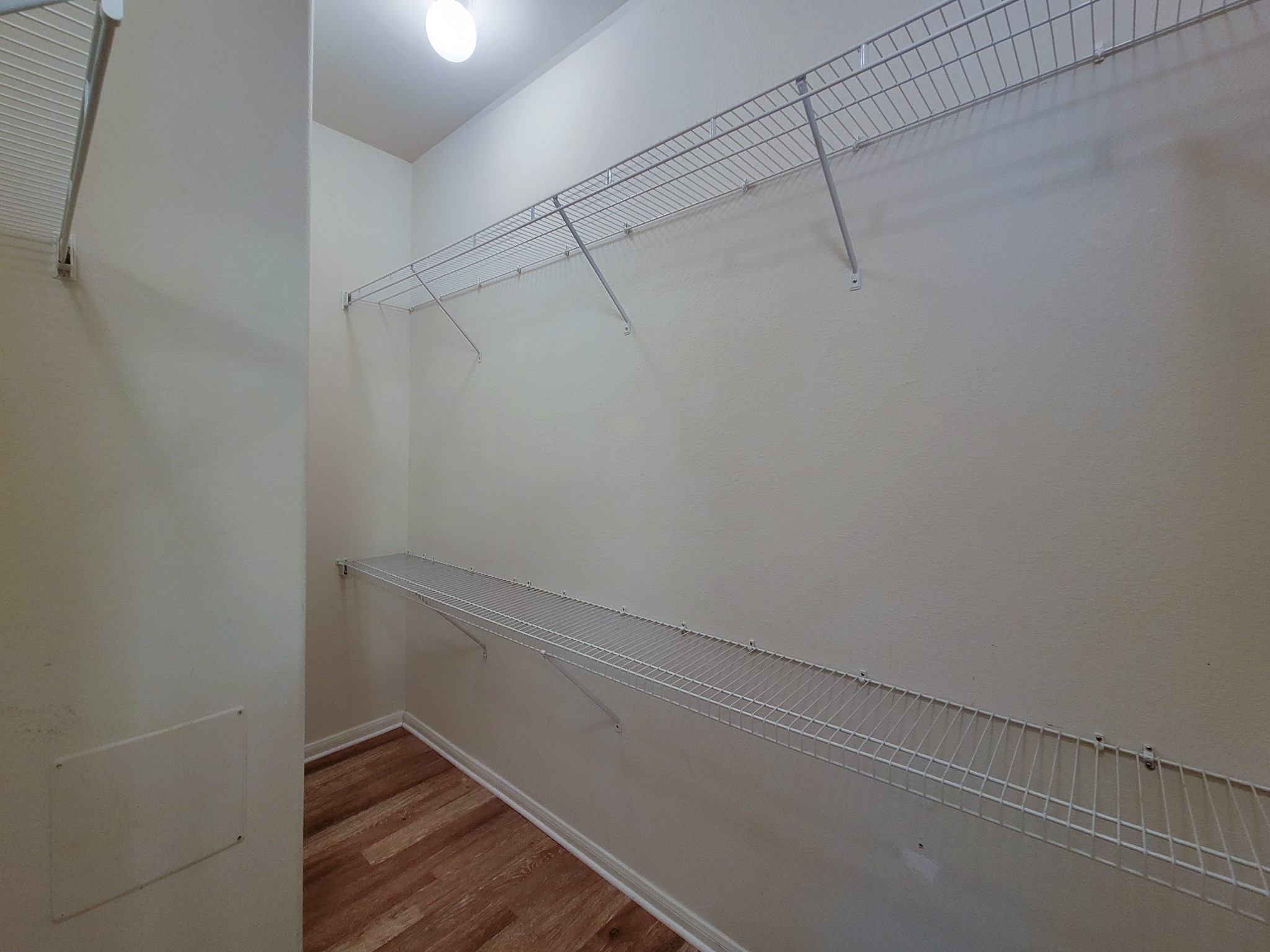 9200 Westheimer Road, Unit 305 Houston, TX 77063 - Photo 16 of 32 a view of a room with racks on the wall