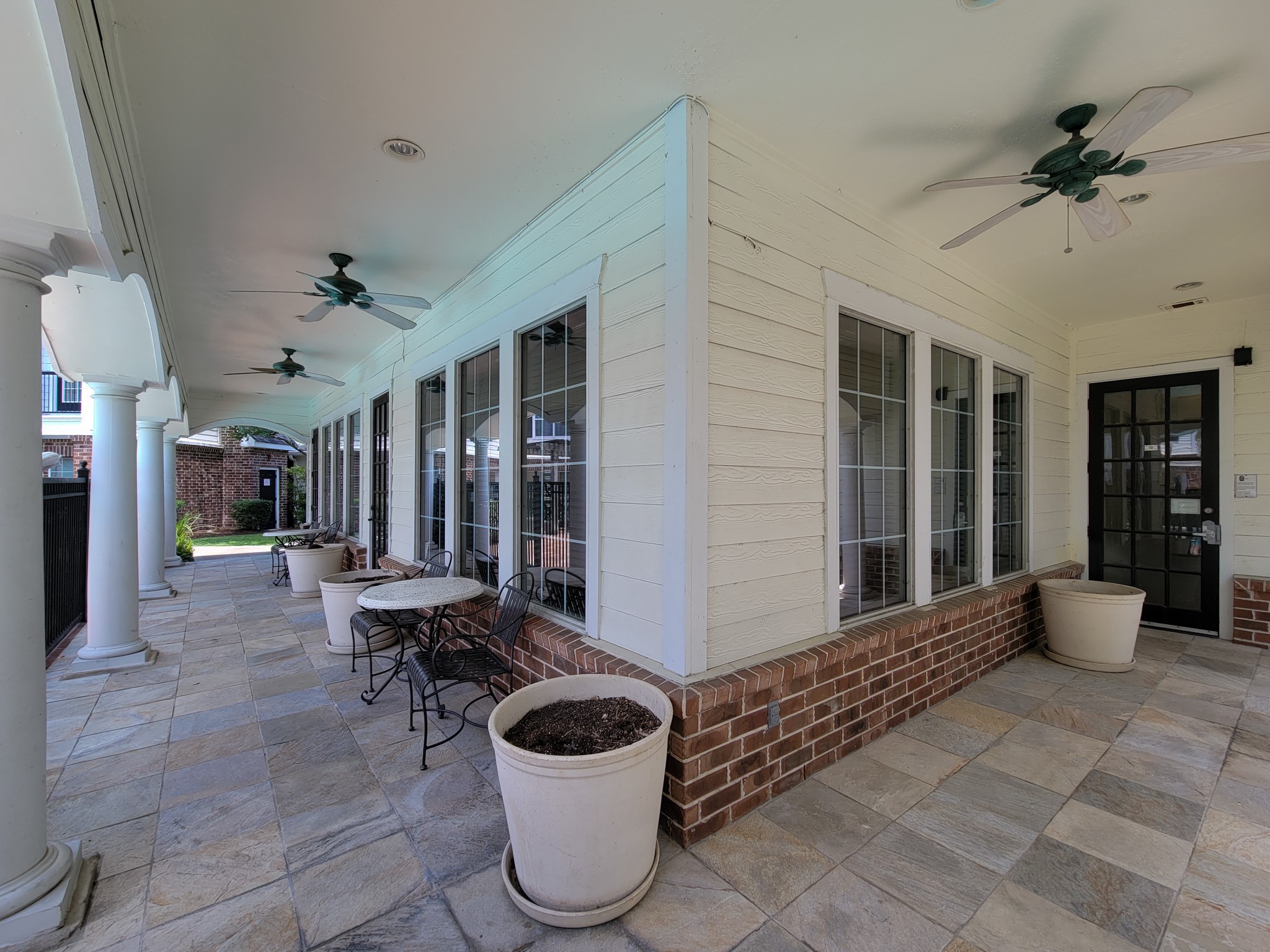 9200 Westheimer Road, Unit 305 Houston, TX 77063 - Photo 29 of 32 a living room with furniture and a potted plant