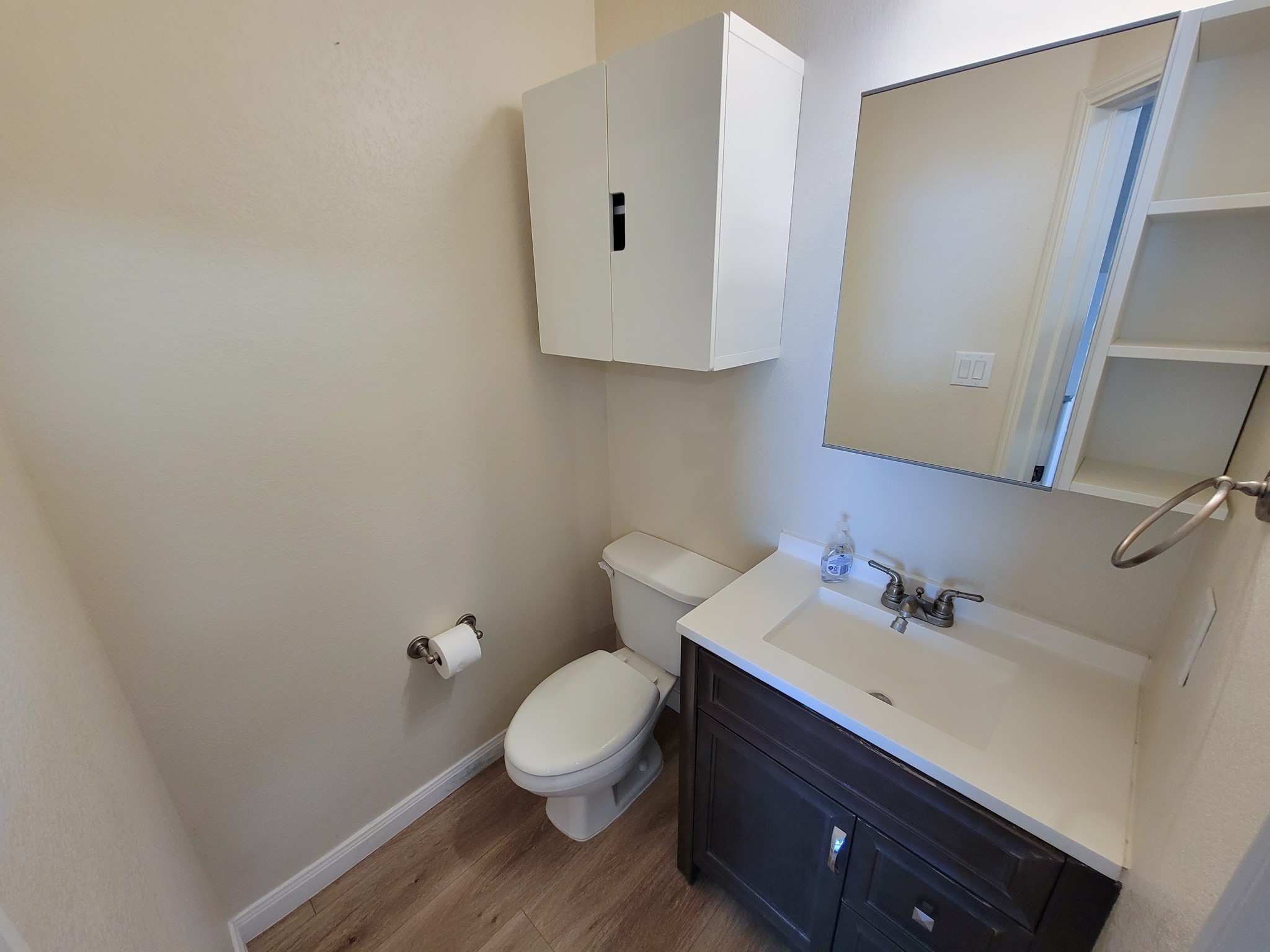 9200 Westheimer Road, Unit 305 Houston, TX 77063 - Photo 3 of 32 a bathroom with a sink toilet and vanity