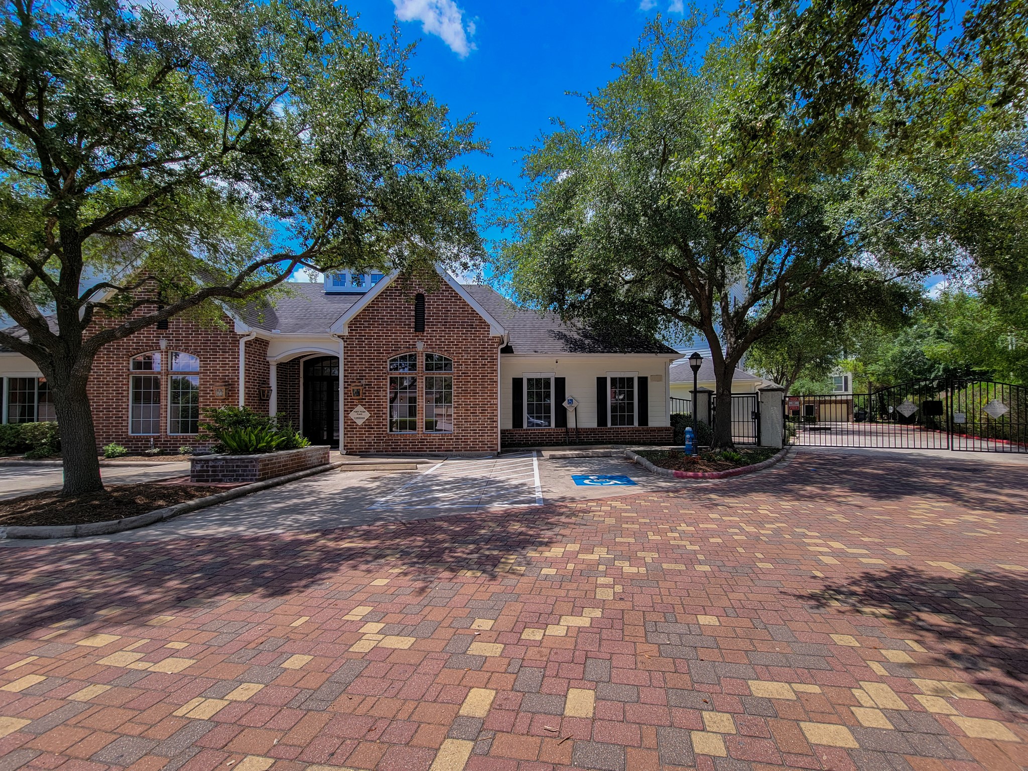 9200 Westheimer Road, Unit 305 Houston, TX 77063 - Photo 32 of 32 a front view of a house with a yard