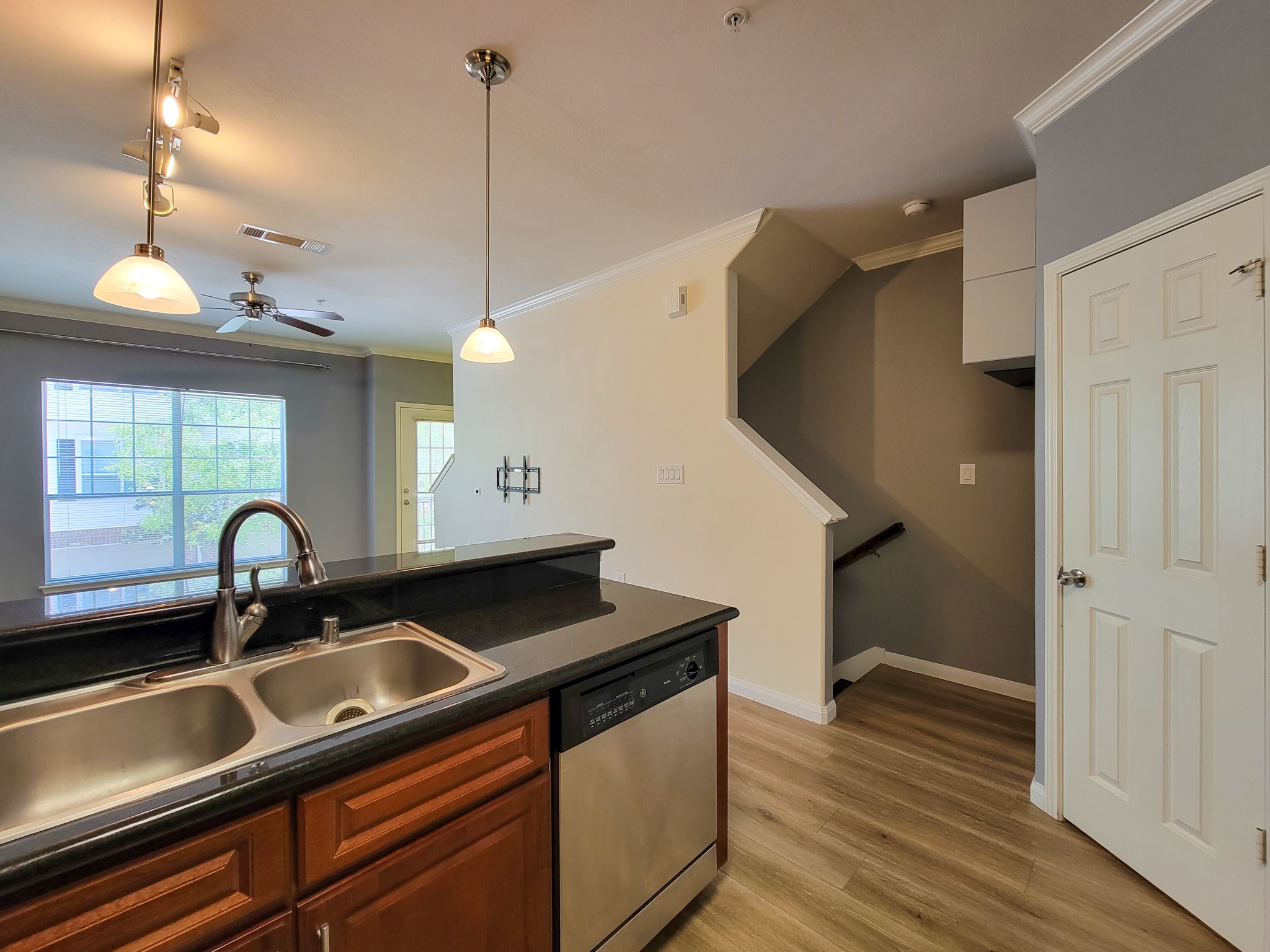9200 Westheimer Road, Unit 305 Houston, TX 77063 - Photo 7 of 32 a kitchen with a sink a counter space appliances and cabinets