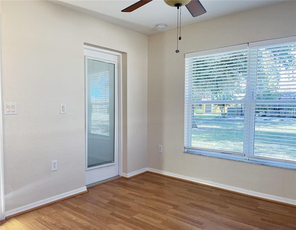 117 Angol Street Punta Gorda, FL 33983 - Photo 27 of 47 a view of an empty room with wooden floor and a window