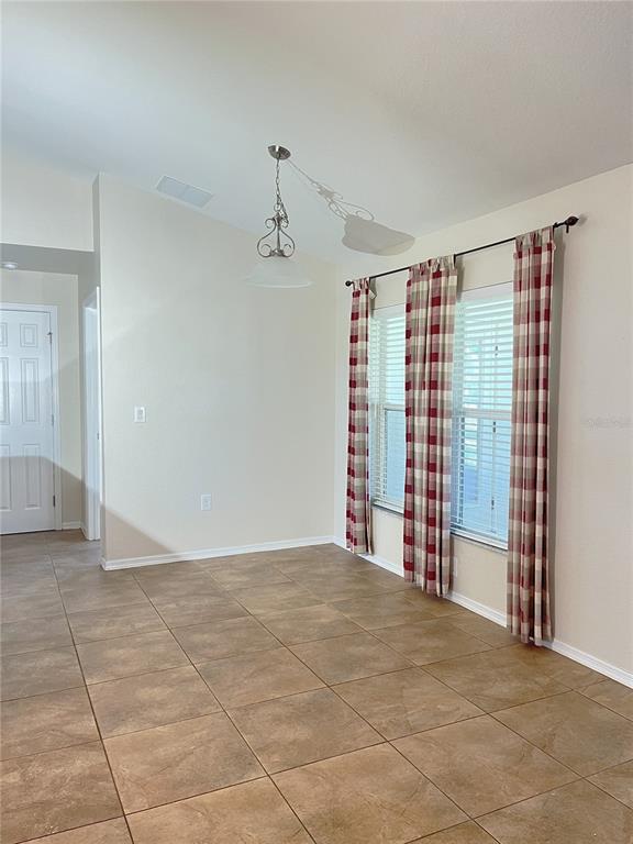 117 Angol Street Punta Gorda, FL 33983 - Photo 8 of 47 a view of an empty room with a window