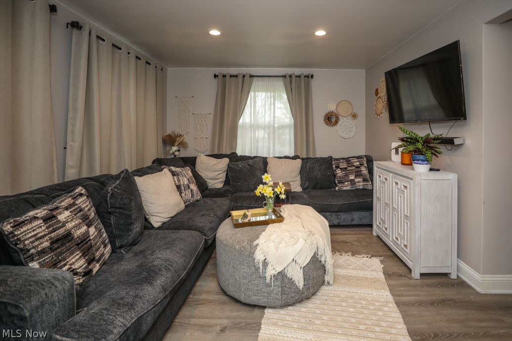 10676 Holcomb Road Newton Falls, OH 44444 - Photo 11 of 38 Living area with LVT and recessed lighting