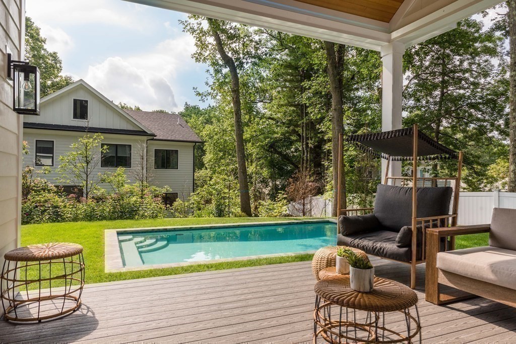 a view of a patio with couches chairs and a yard
