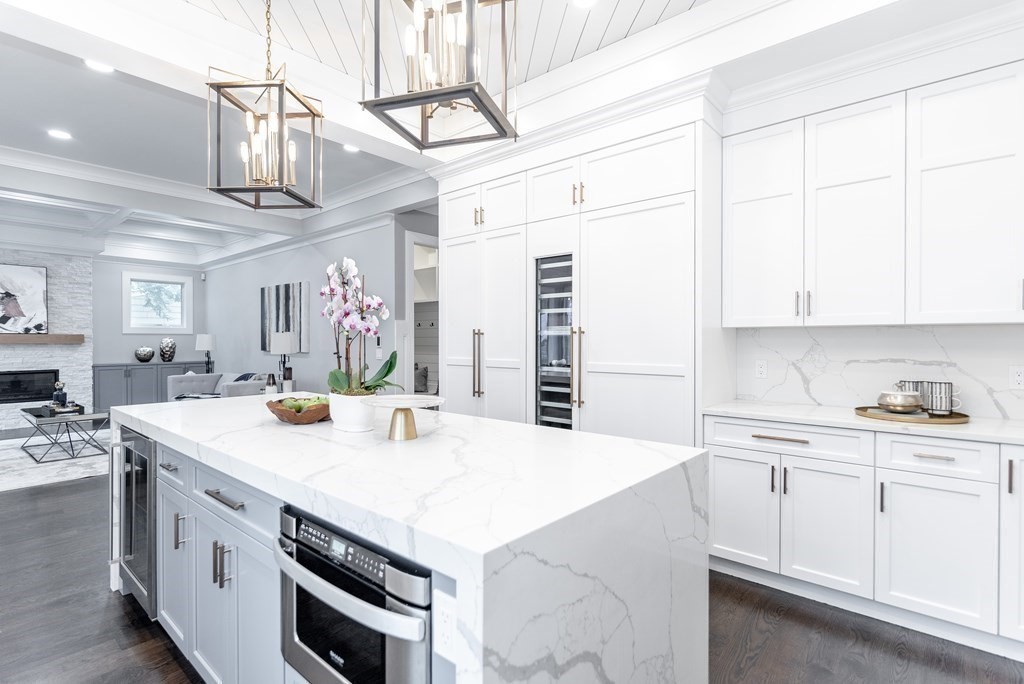 35 Wayne Road Newton, MA 02459 - Photo 13 of 33 a kitchen with stainless steel appliances granite countertop a sink a stove and cabinets