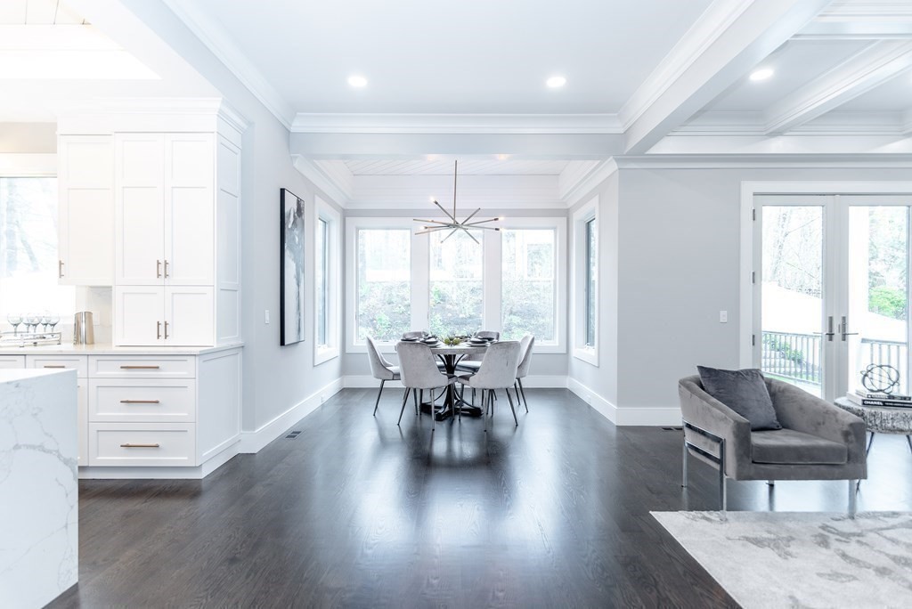 35 Wayne Road Newton, MA 02459 - Photo 15 of 33 a dining room with wooden floor a chandelier a wooden table and chairs