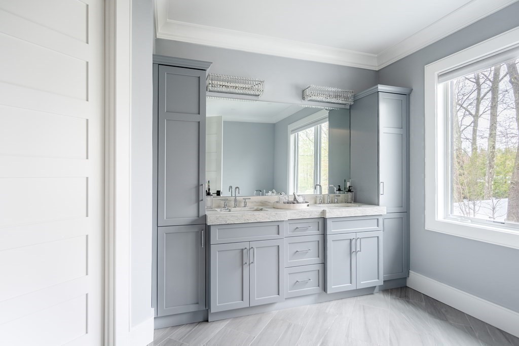 35 Wayne Road Newton, MA 02459 - Photo 21 of 33 a bathroom with a granite countertop sink mirror and a bathtub
