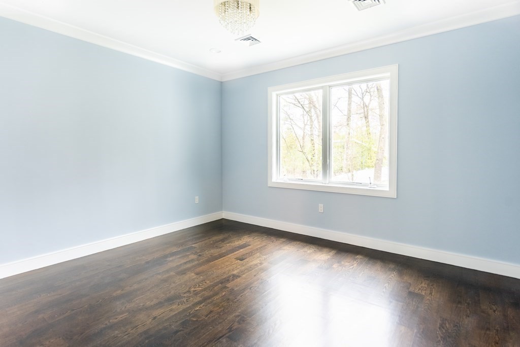 35 Wayne Road Newton, MA 02459 - Photo 25 of 33 an empty room with wooden floor and windows