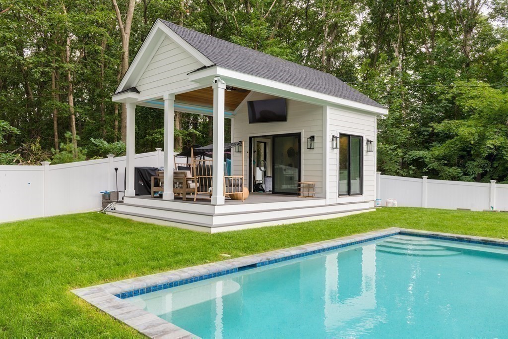 35 Wayne Road Newton, MA 02459 - Photo 30 of 33 a view of a house with a backyard patio and swimming pool