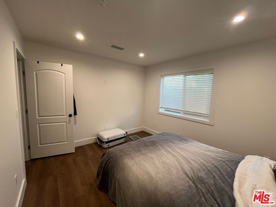 8302 Capps Avenue Northridge, CA 91324 - Photo 11 of 16 a bedroom with a bed and a window