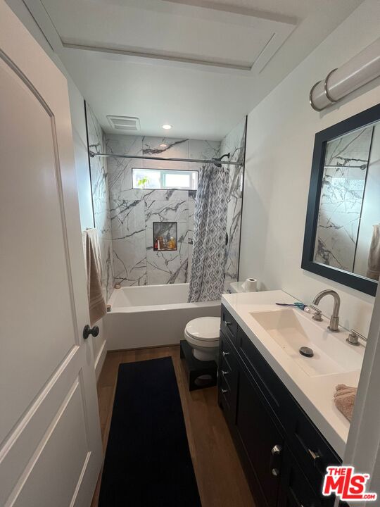 8302 Capps Avenue Northridge, CA 91324 - Photo 13 of 16 a bathroom with a sink a toilet and a bathtub