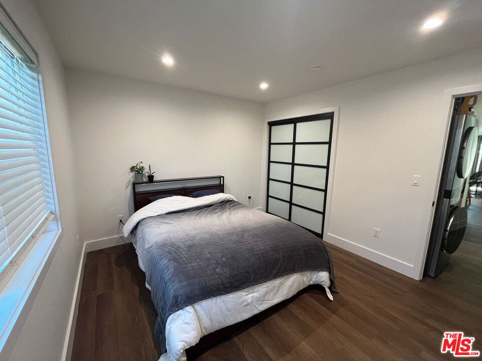 8302 Capps Avenue Northridge, CA 91324 - Photo 10 of 16 a bedroom with a bed and a window
