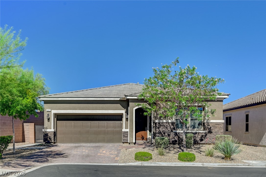 8197 Riley Love Street Las Vegas, NV 89139 - Photo 1 of 48 A well-maintained facade features a two-car garage, welcoming entry, and low-maintenance landscaping.